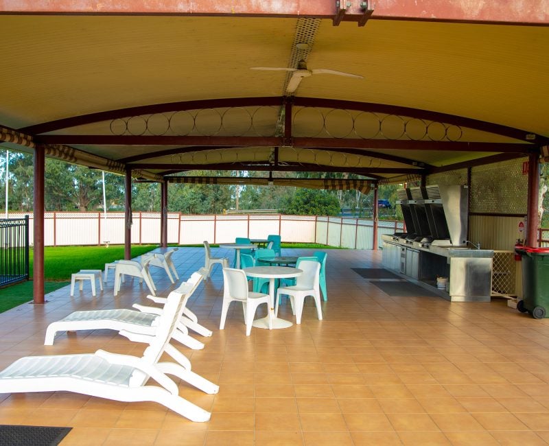 A covered outdoor BBQ and lounge area at Nandewar Motor Inn.