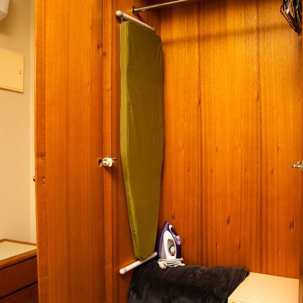 Nandewar Motor Inn room wardrobe or closet, containing guest amenities