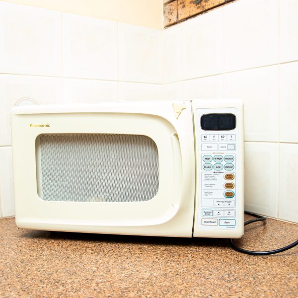 A close-up of a microwave oven on a kitchen counter.