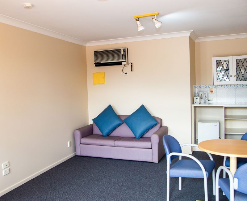 Lounge and kitchenette area of Nandewar Motor Inn's room.