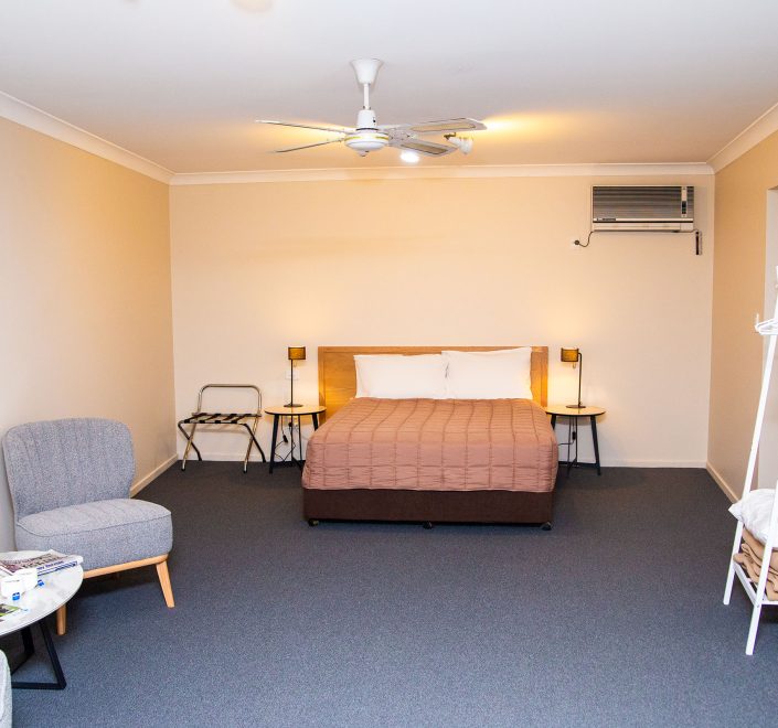 The full interior of Nandewar Motor Inn room, displaying the sleeping, lounge, and amenity areas.